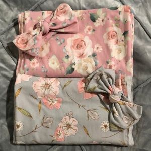 Swaddle blanket with matching bows.
